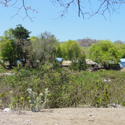 West Timor village can be seen from across the river from Batugade Village, Timor Leste.